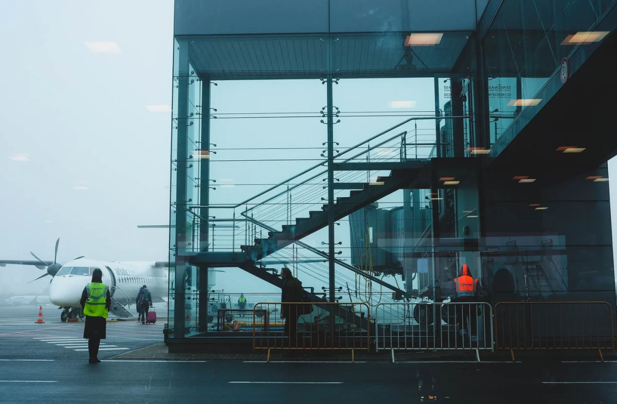 Aircraft and ground operations beside an airport terminal